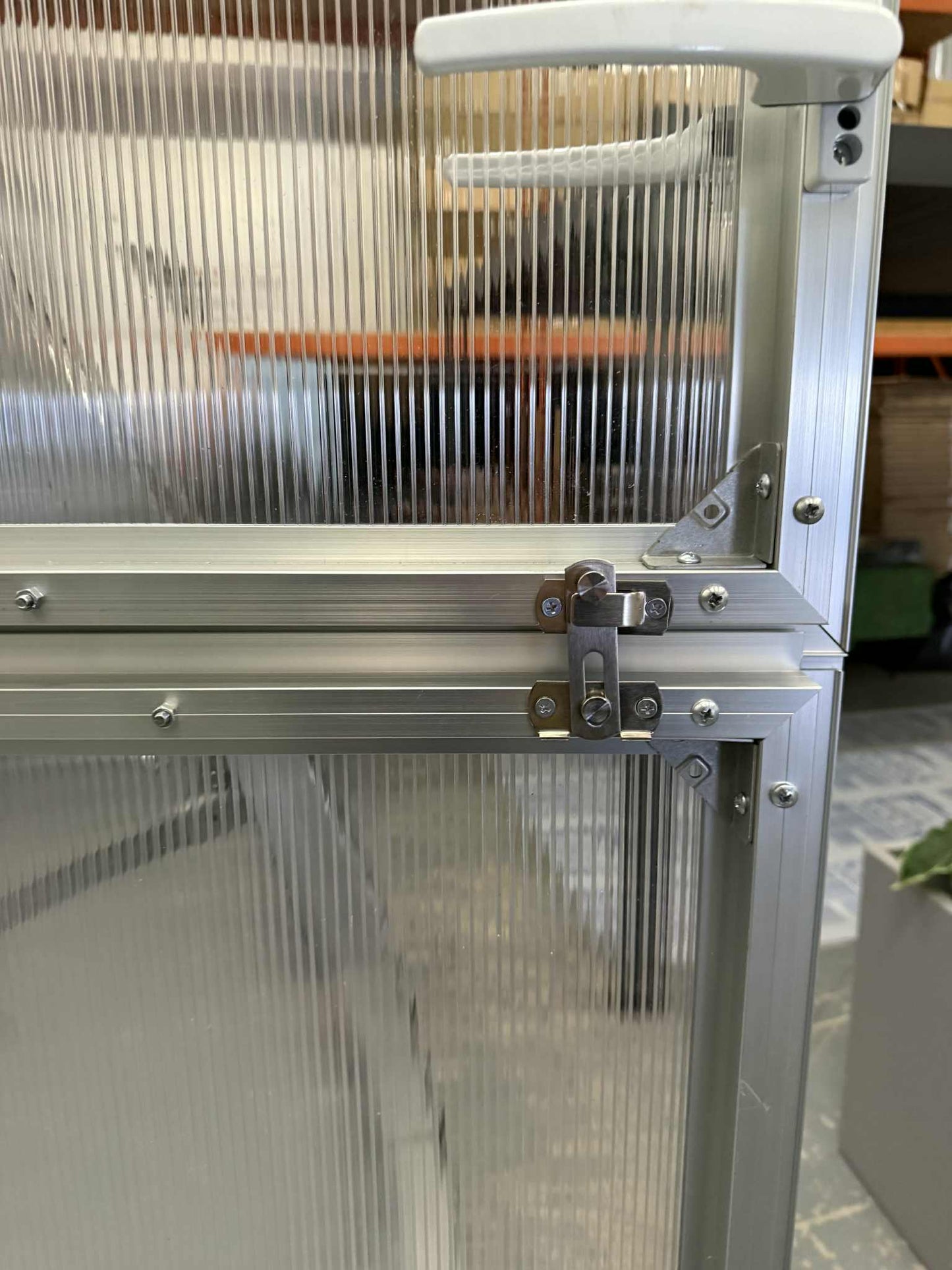 Metallic framed door for Sigma 250 (Gen III) greenhouses with a latch mechanism