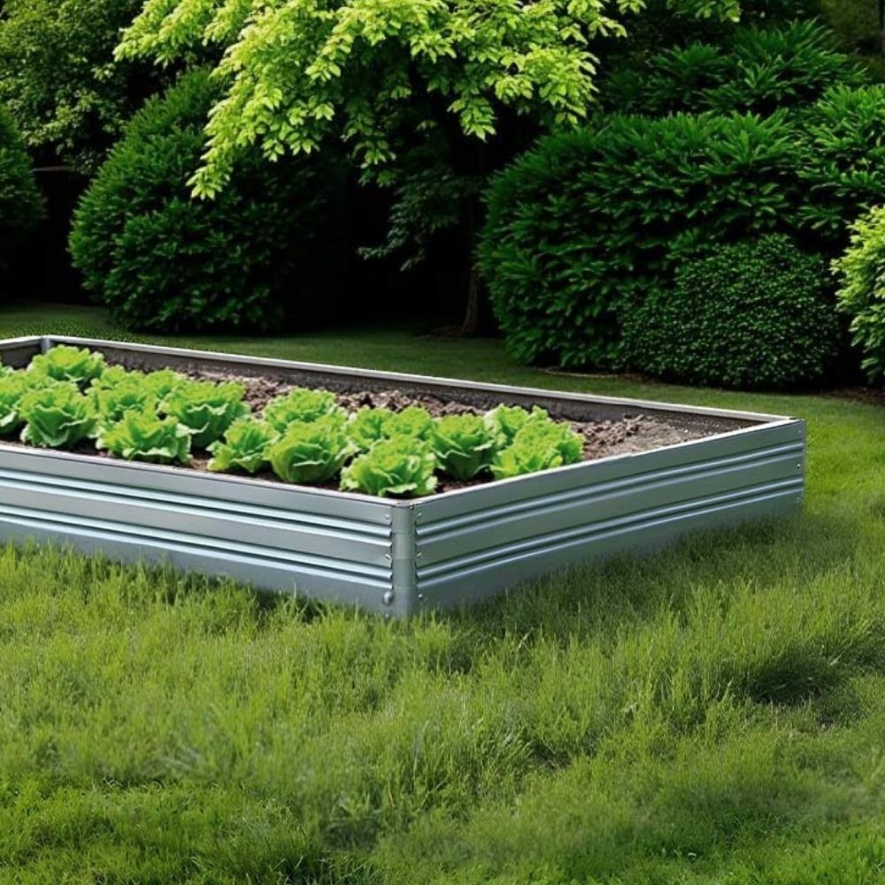 Metal raised Planta garden bed - 1 tier with green plants in a garden setting