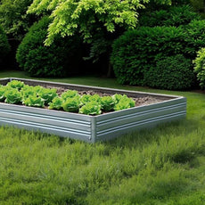 Metal raised Planta garden bed - 1 tier with green plants in a garden setting